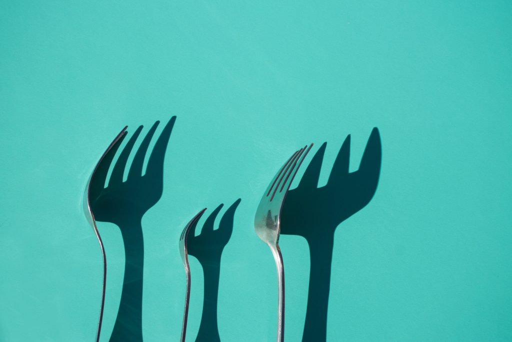 Three forks with shadows